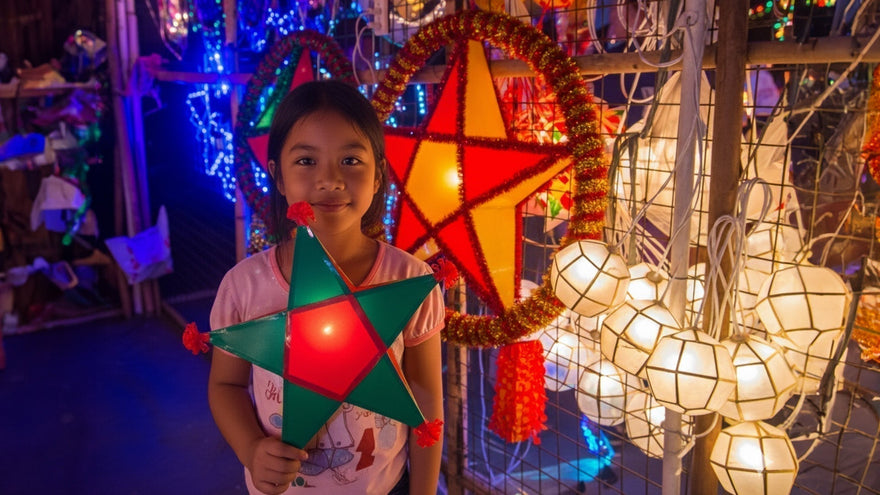 a-child-holding-a-parol-mang-kosme-blog